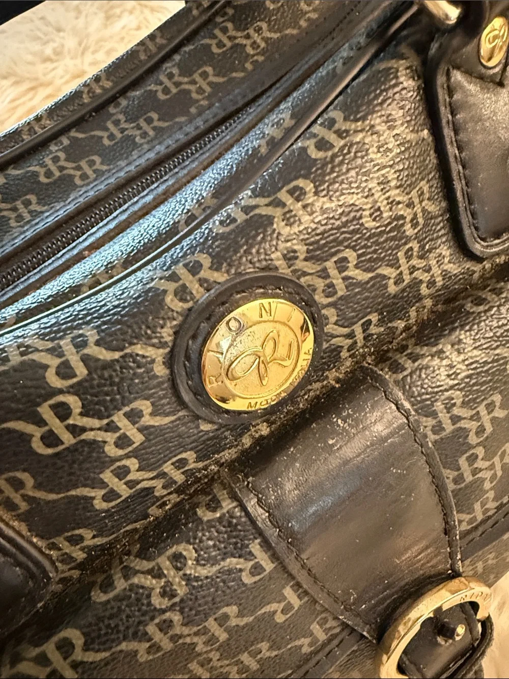 Rioni Signature Organizer Satchel featuring a black monogram 